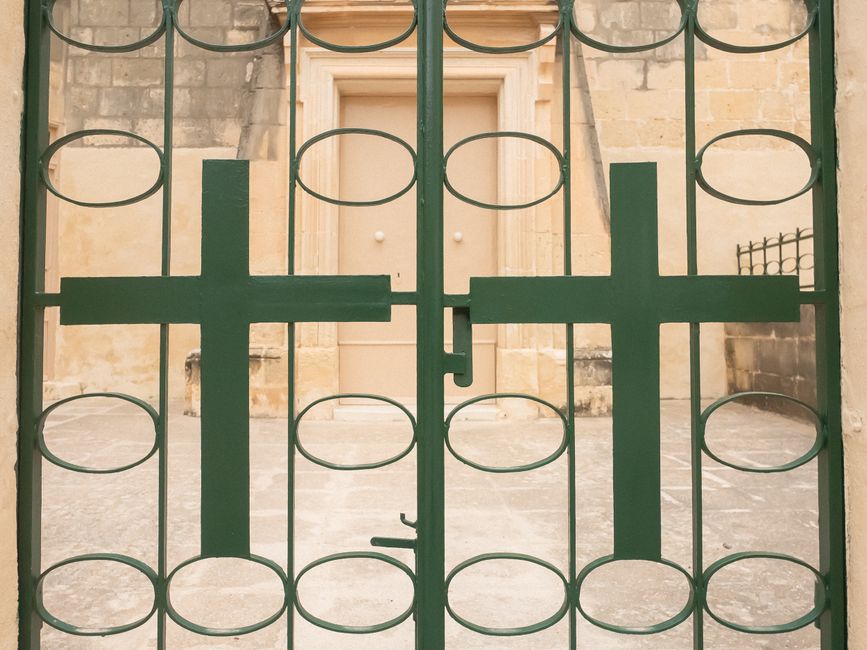 An ornate metal gate seen from the front