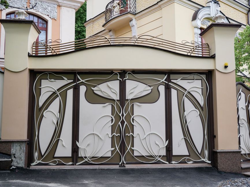 A painted iron gate closed across an entrance