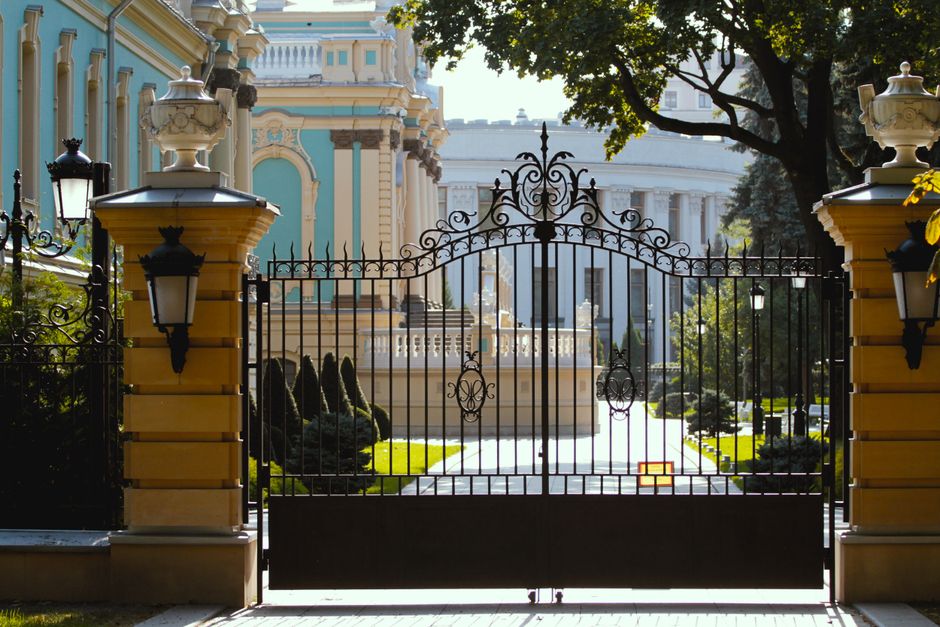 A painted iron gate closed across an entrance
